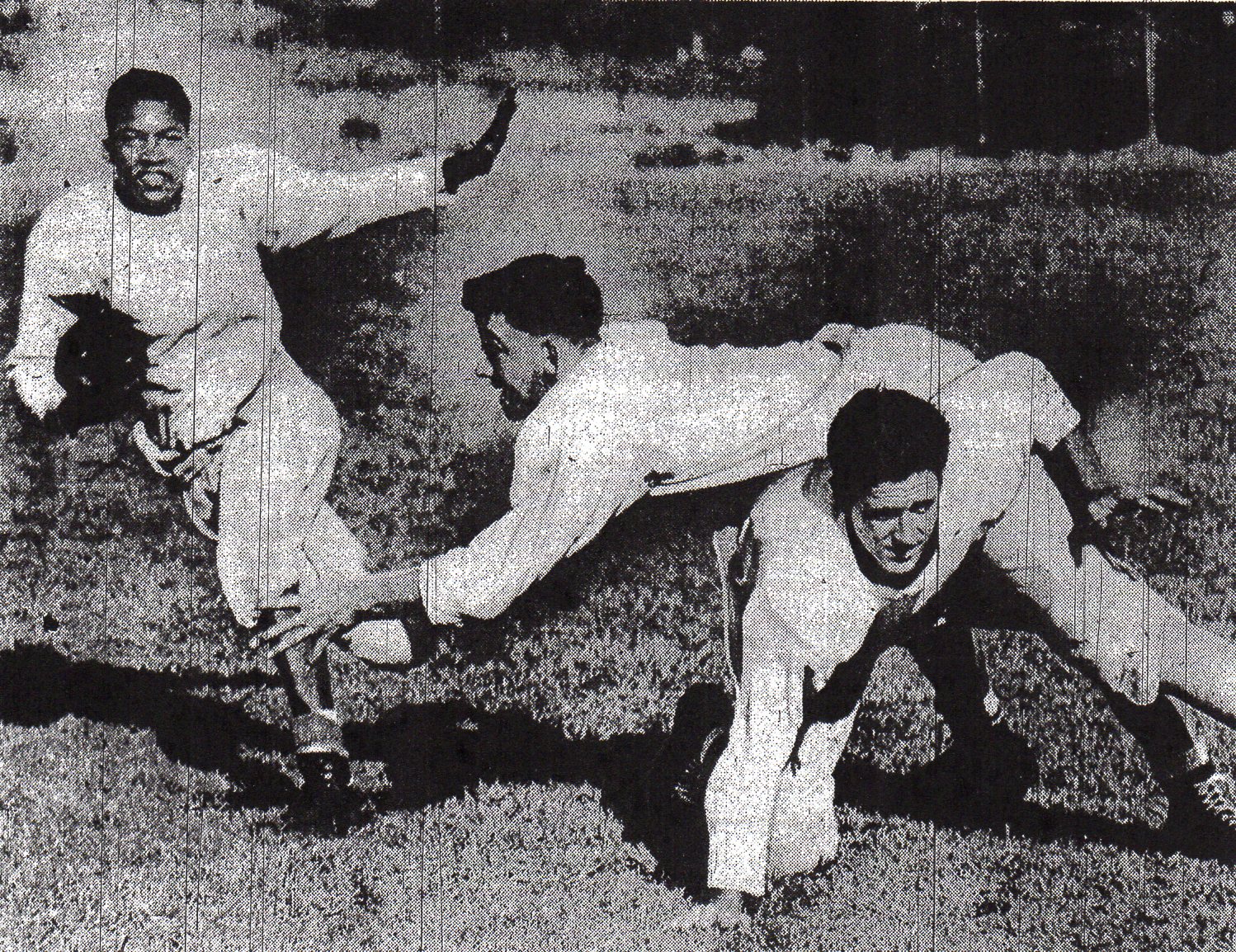 Photographer called for similar pose in shoot at San Diego High, where Ted Ritchey eludes Harvey Smith, who is blocked by Gordon Dale.