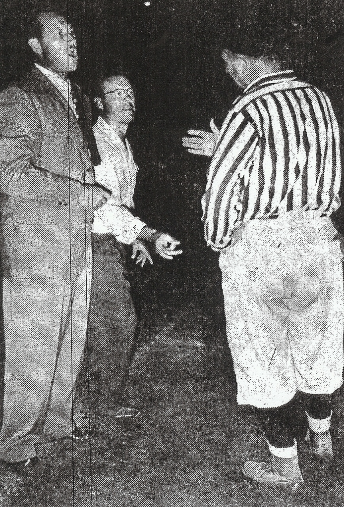 Harold Hopkins of Pomona (left) and Duane Maley of San Diego aren't happy with explanation by referee W.W. Wilson. Jopins and Maley were losing coaches of Southern California all-stars.