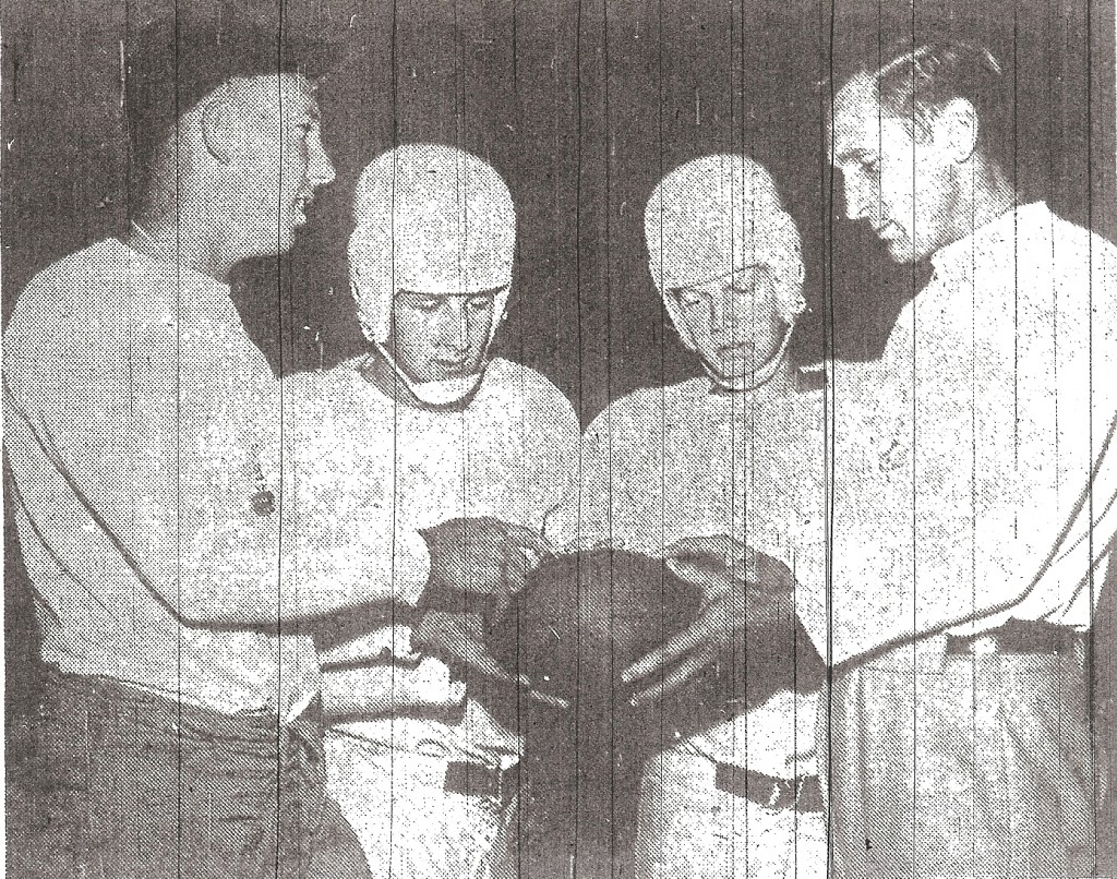 Escondido assistant coach Bob (Chick) Embrey, Bill Stewart, Larry Cope, and head coach Walt West (from left) inspect rubber ball.