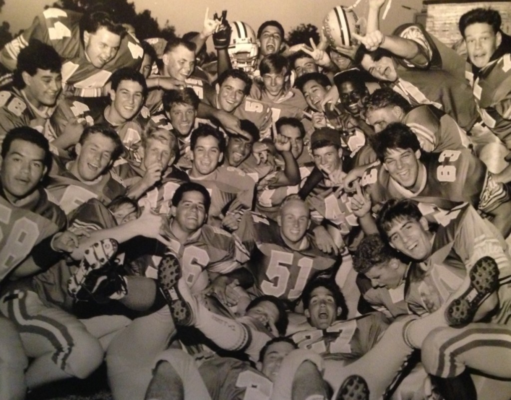 Todd Tobias (51) thought he was posing for an individual photograph but instead was photo bombed by his Grossmont teammates.