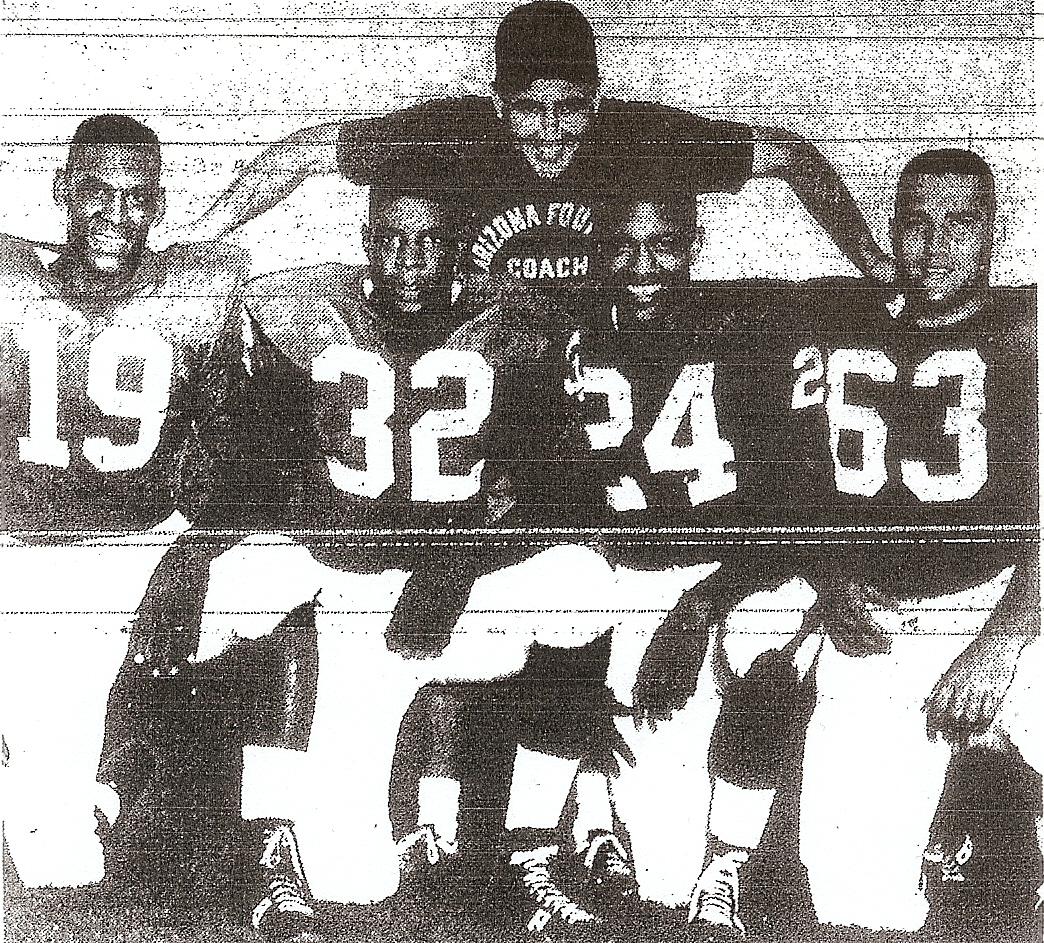 University of Arizona coach Jim LaRue huddled with former area prep stars turned Wildcats, from left: Lou White (San Diego), Preston Davis (Lincoln), Thomas Phillips (San Diego), and Dave DeSonia (Clairemont).