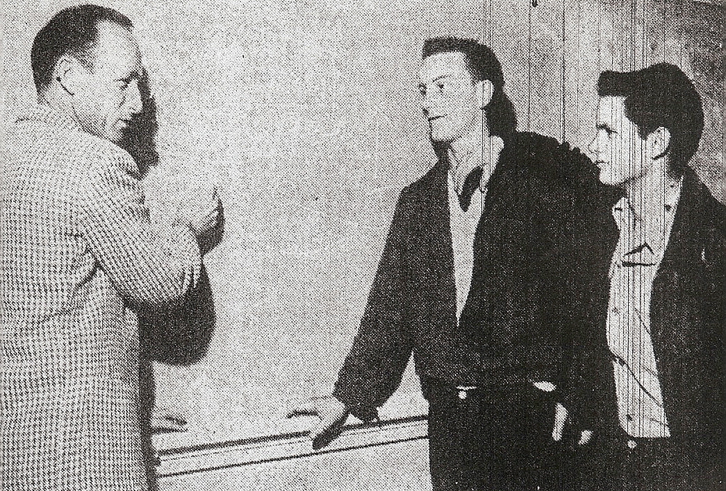 DeVore chalk talked with quarterback Bob Franklin (center) and fullback Billy Lancaster fore game with Central.