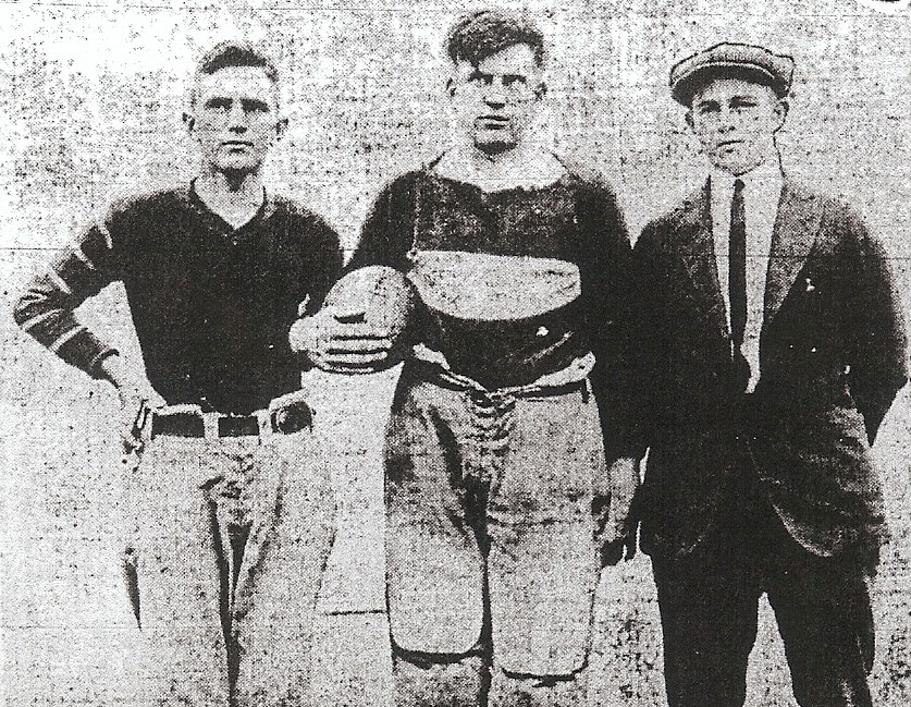 Thompson (right) flanked Price and Bill (Bull) Salyers, the 175-pound center and team leader.