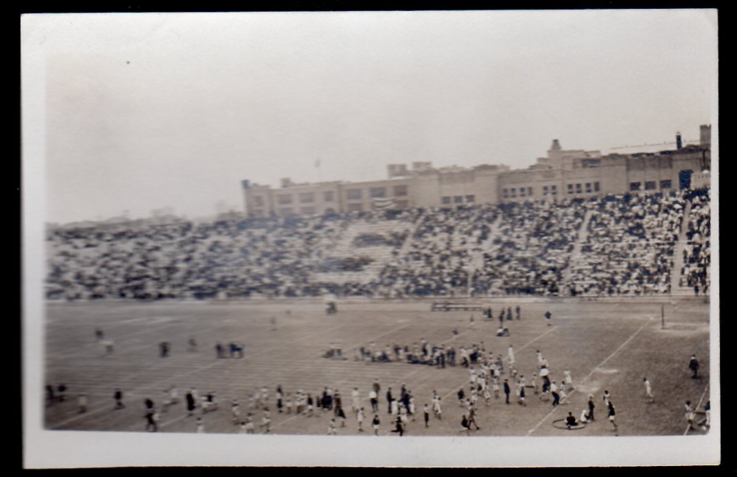 Stadium became the city's sports venue, as baseball home plate and football yard lines are visible during what appears to an early interclass track-and-field meet.
